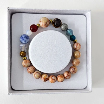Imagine din Bratara 10 Planets Red Veined White Onyx, din pietre semipretioase in cutie cadou, semnificand planetele galaxiei